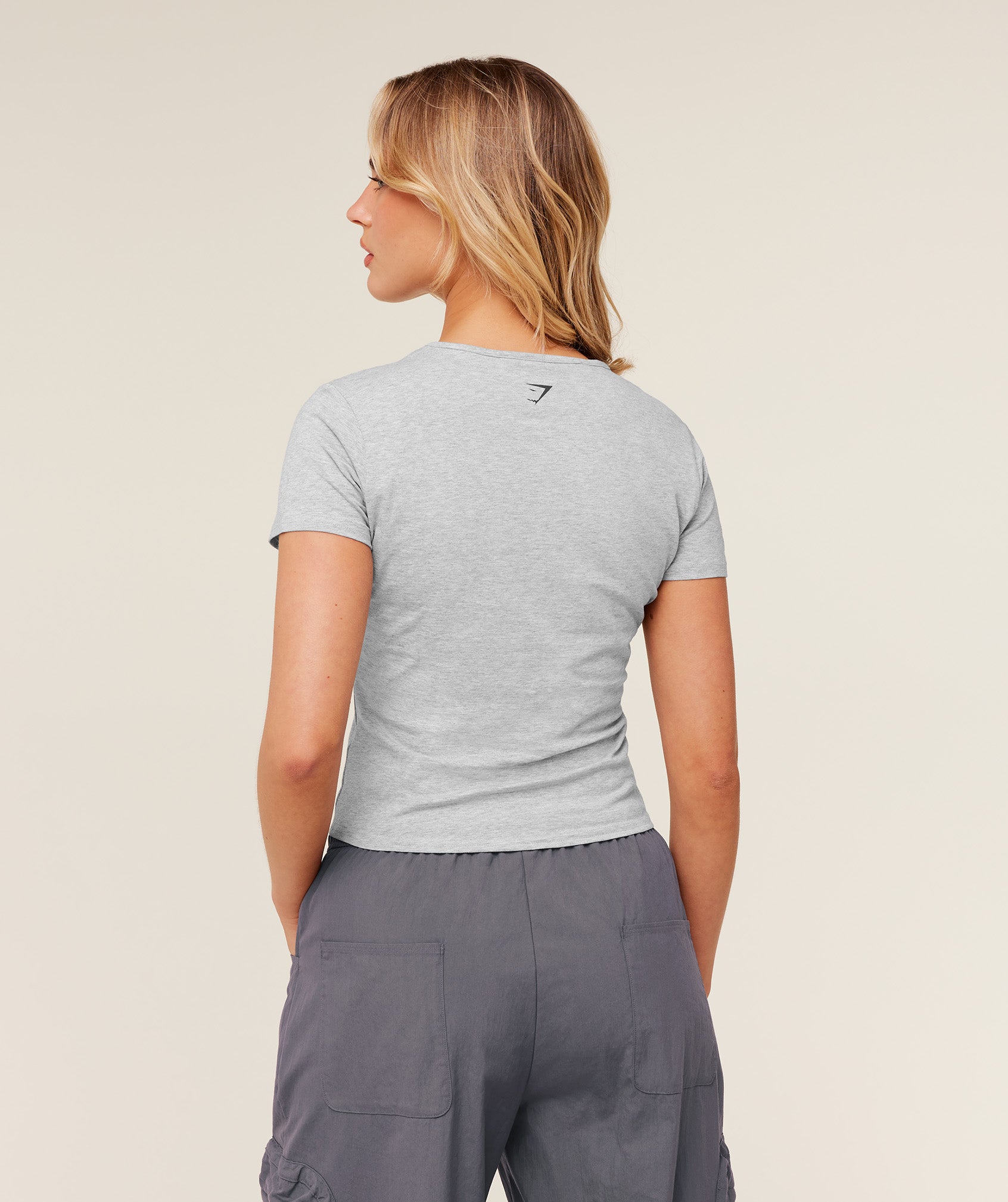 Worn Crest Graphic Baby Tee - Image 2